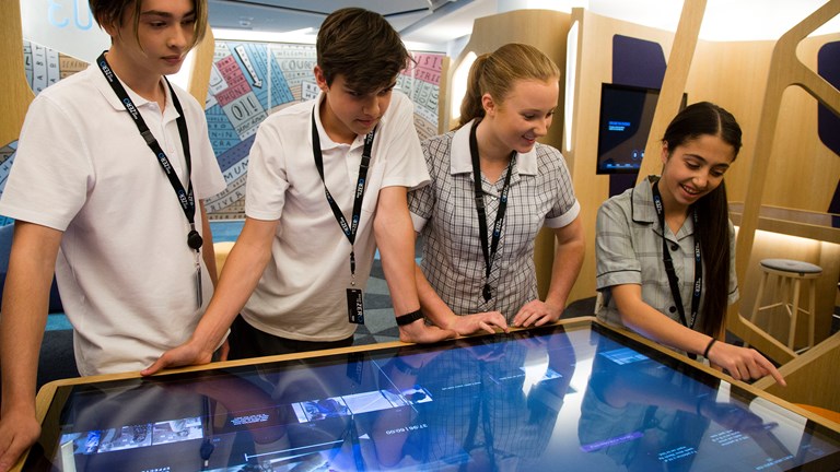 Students engaging with the TAC Road To Zero Education Learning Centre interactives