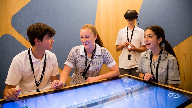 Students engaging with the TAC Road To Zero Education Learning Centre interactives.