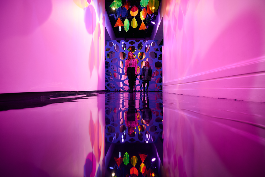 2 girls in awe as they discover an immersive walkway.